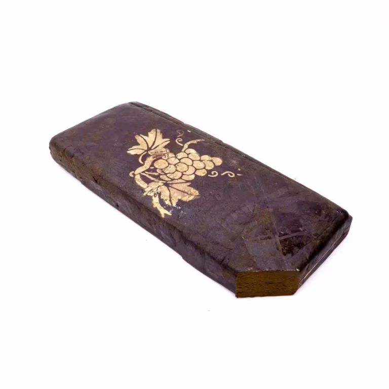 Rich dark chocolate bar with gold decorative grapevine design, luxurious and artisanal treat for chocolate lovers. Perfect for special occasions or indulgent gifting.