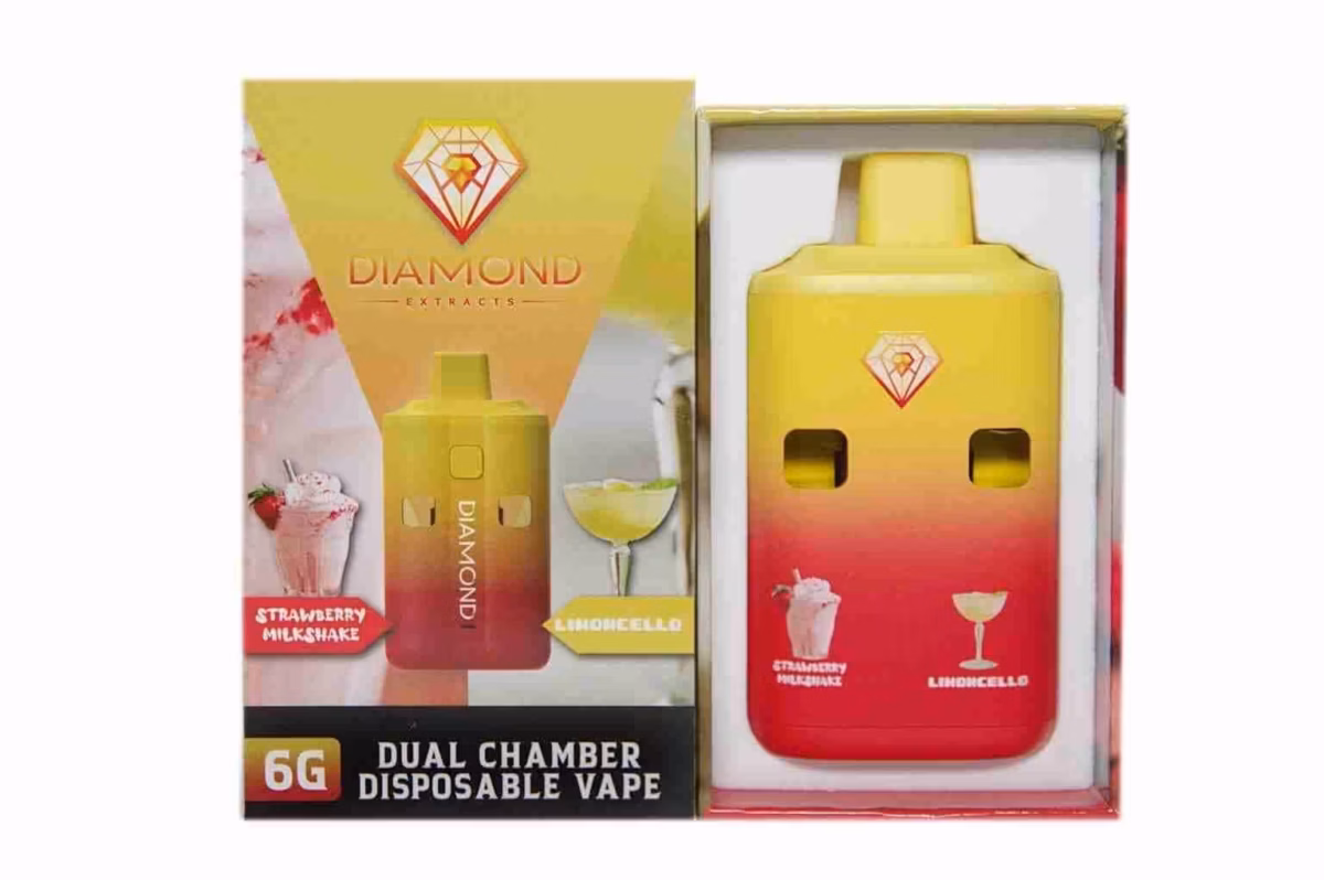 Vape device with yellow and red gradient design featuring Diamond Extracts branding for cannabis concentrates and pre-filled cartridges.