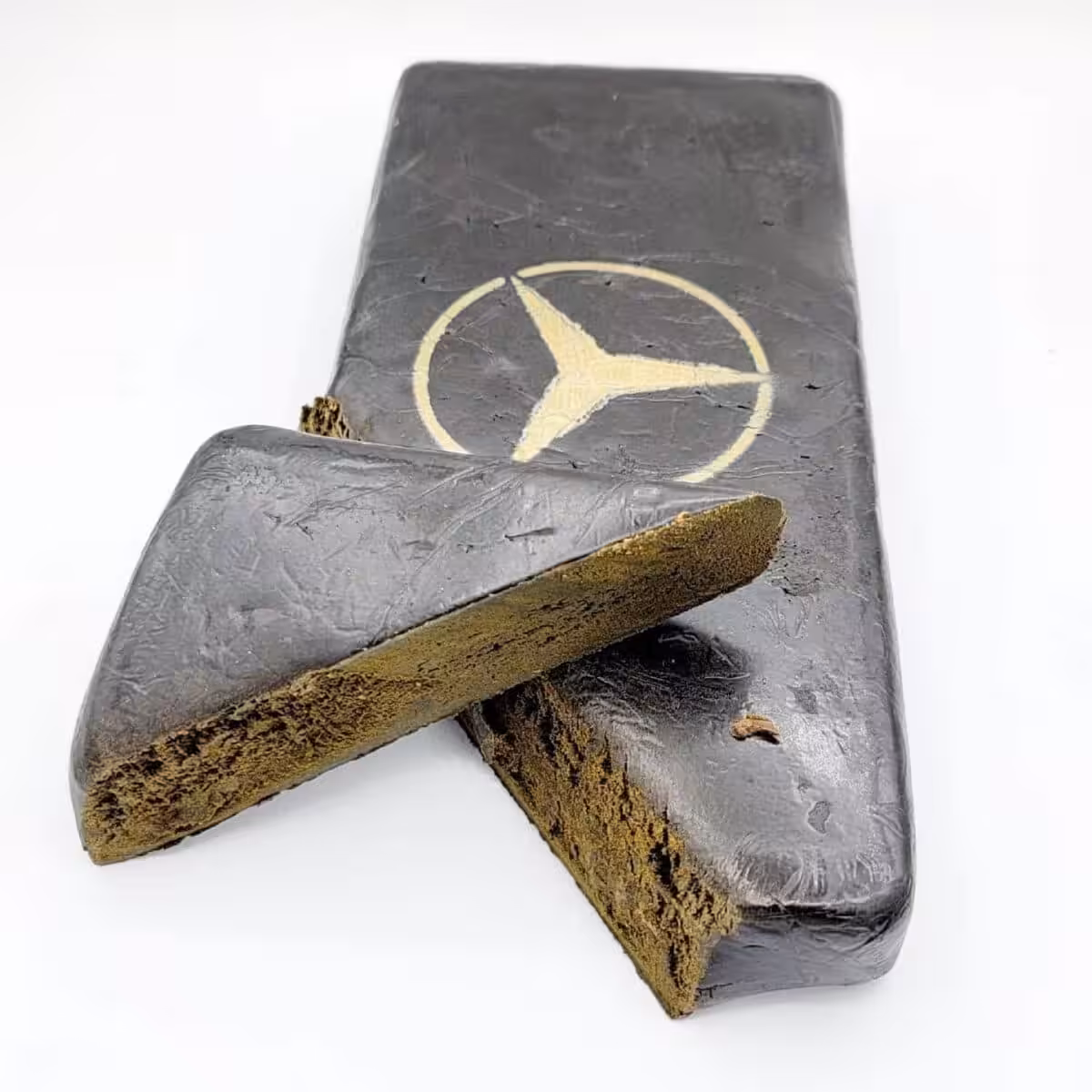High-quality cannabis block with Mercedes-Benz logo, perfect for cannabis enthusiasts seeking top-tier product and unique packaging.
