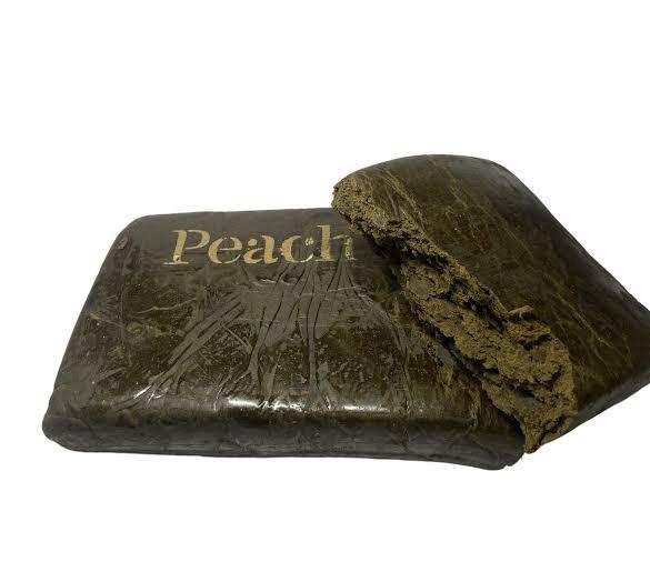 High-quality Peach Hash concentrate loaded with THC for potent effects and rich flavor. Perfect for cannabis enthusiasts seeking premium hash products.