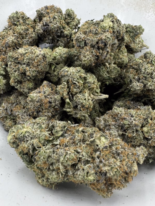 High-quality cannabis flower with frosty trichomes and vibrant green buds. Perfect for relaxing, premium quality, and heavy effects.