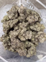 Frosty, high-quality cannabis buds with vibrant purple hues and dense trichomes for optimal potency. Perfect for connoisseurs seeking top-tier marijuana flower.
