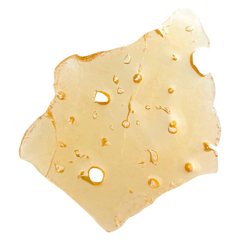 Close-up of a cannabis-infused edible slice with a yellowish hue, featuring small air bubbles and a smooth texture, ideal for cannabis enthusiasts and health-conscious consumers.