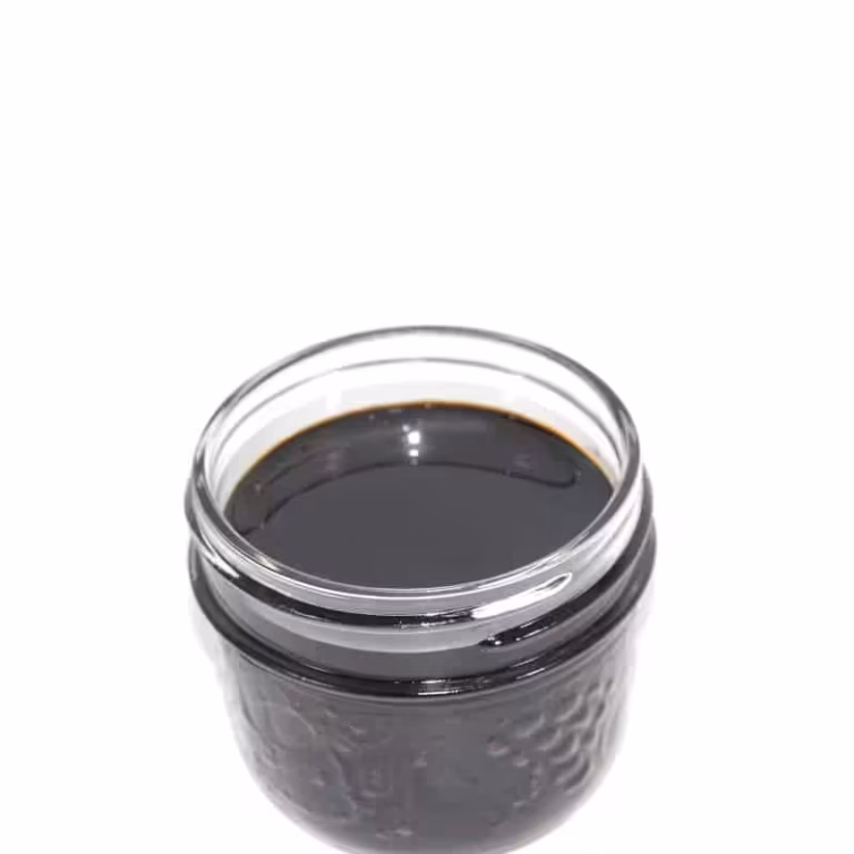 Rich black cannabis concentrate in a glass jar, premium quality for adult use, high potency, best selection from trusted dispensaries in Canada, perfect for medicinal or recreational cannabis enthusiasts.