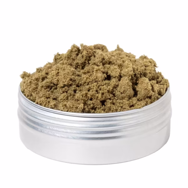 Close-up of high-quality cannabis kief in a metal container, showcasing fine, aromatic trichomes essential for experienced users looking for potent cannabis concentrates.
