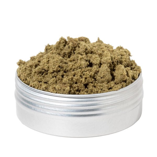 Close-up of high-quality cannabis kief in a metal container, showcasing fine, aromatic trichomes essential for experienced users looking for potent cannabis concentrates.